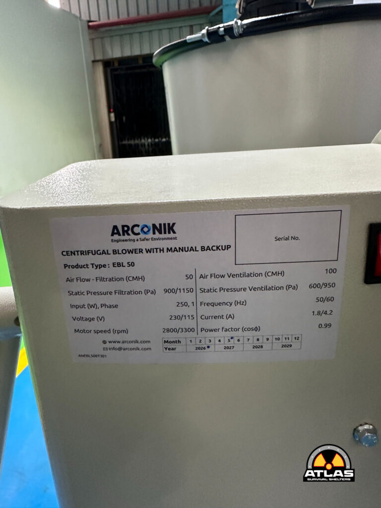 Close-up of an Arconik centrifugal blower with a specs label; Atlas logo bottom right.