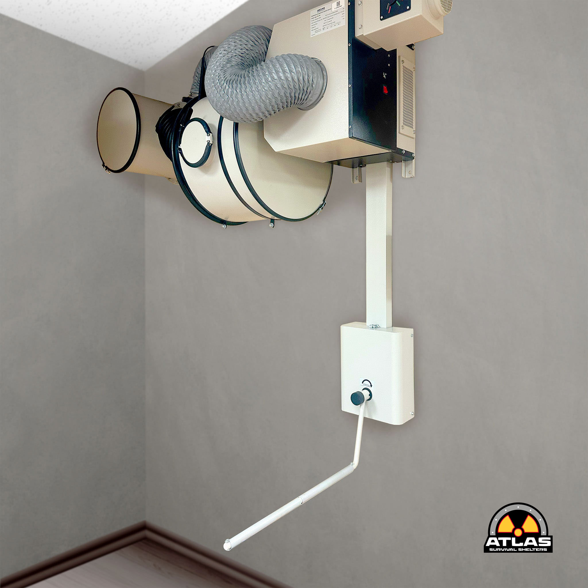 Industrial ventilation unit with a flexible silver duct connected to a white control box mounted on a metal post, Atlas Survival Shelters logo visible in the bottom right corner.