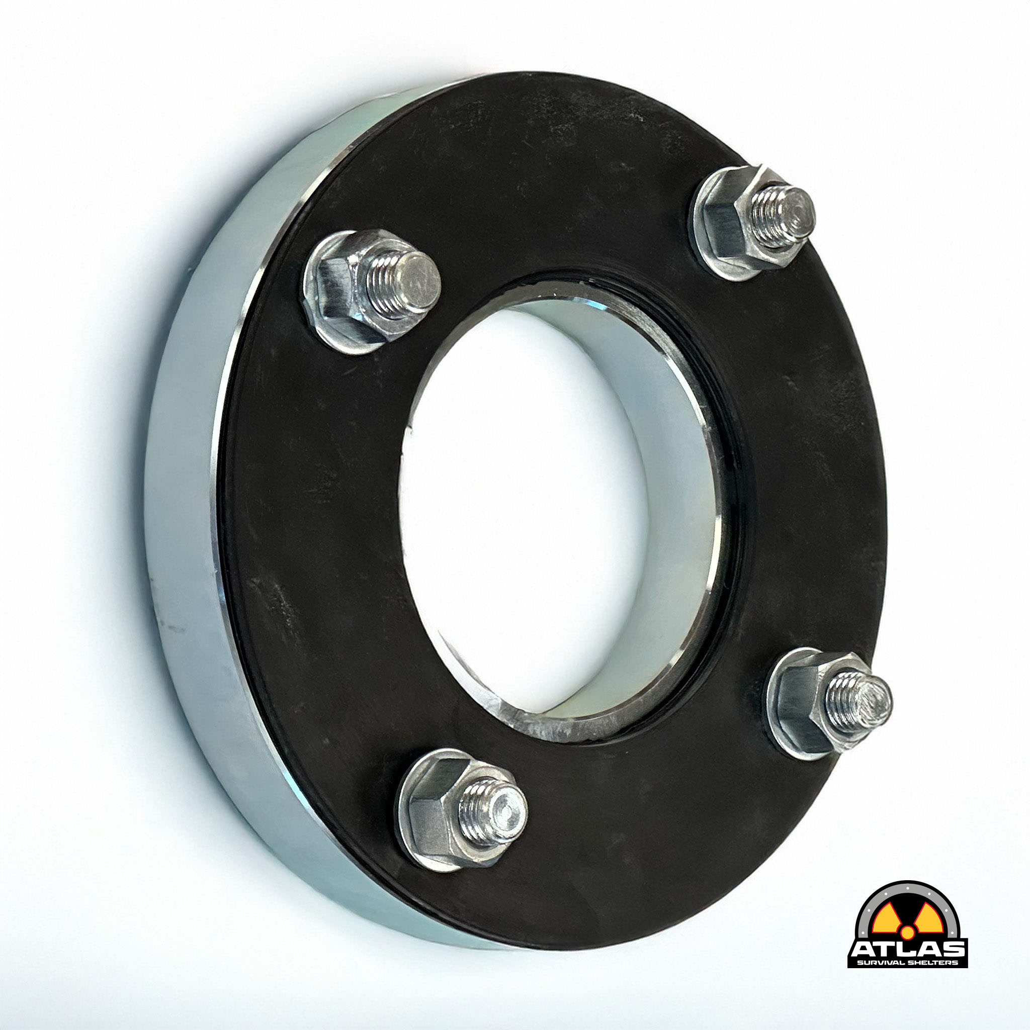 Close-up of a black circular metal flange with six bolts around the edge and an Atlas Survival Shelters logo in the bottom right.