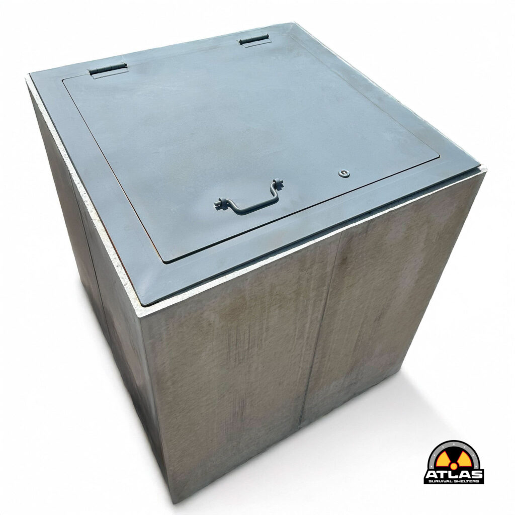 Grey metal storage chest with a hinged lid and front handle; Atlas Survival Shelters logo visible in the bottom-right corner.