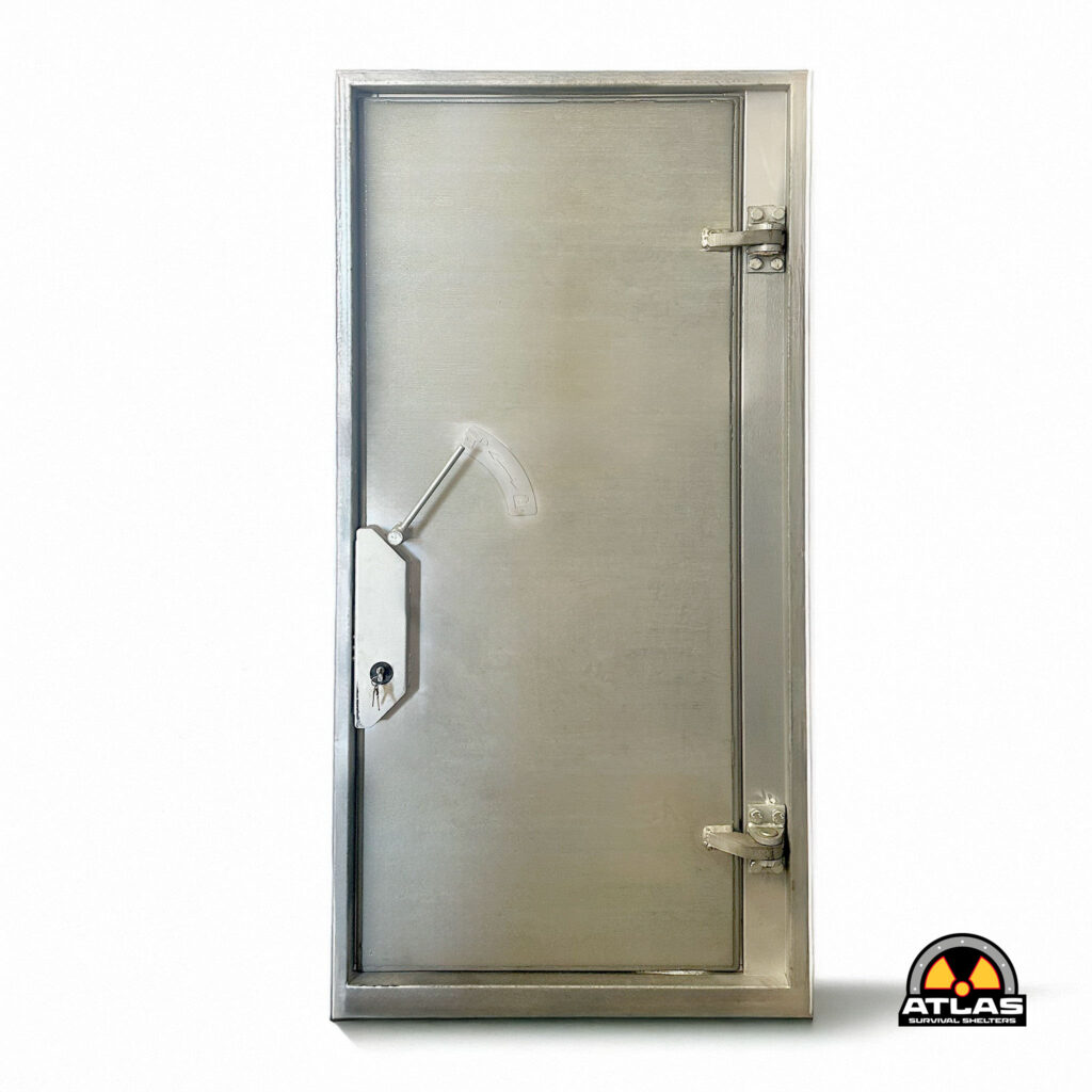 Steel security door with a right-side locking hinge and key cylinder at the bottom left; Atlas Survival Shelters logo in the lower-right corner.